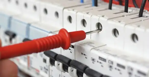 Electrical contractor testing circuit breakers during electrical repair in Creve Coeur, IL