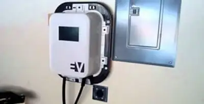Electric car charger installation with wall-mounted EV charging station in Peoria, IL