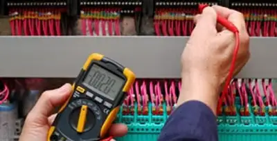electrical service showing professional testing and troubleshooting of electrical panel by licensed electricians in Peoria, IL