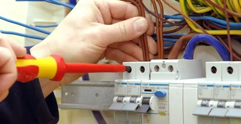 electrician services performing professional electrical panel wiring and connections in Peoria, IL