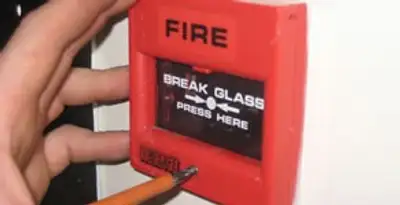 fire alarm installation service showing manual fire alarm pull station installed by licensed electricians in Peoria, IL
