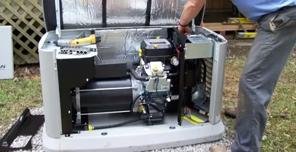 generator installation service showing technician connecting and configuring generator components in Peoria, IL