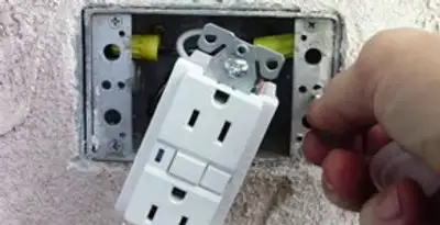 gfci circuits service showing installation of a ground fault circuit interrupter outlet by licensed electricians in Peoria, IL
