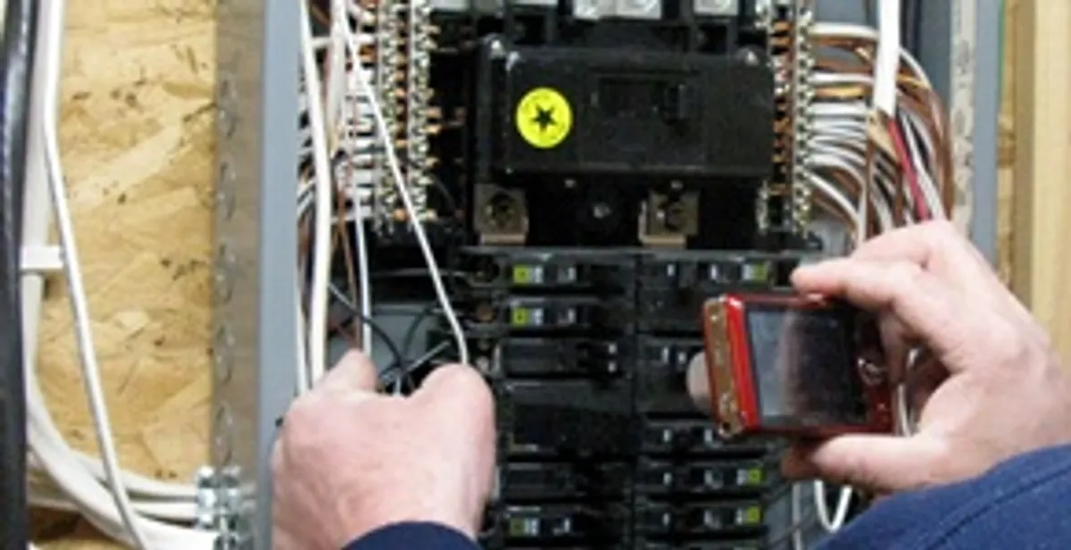 Home electrical inspection of circuit breaker panel by licensed electrician in Peoria, IL