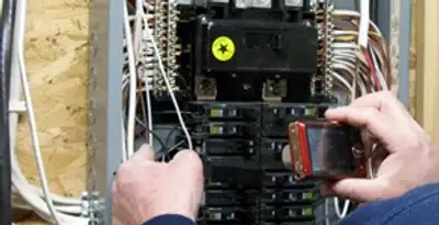 Home electrical inspection of circuit breaker panel by licensed electrician in Peoria, IL