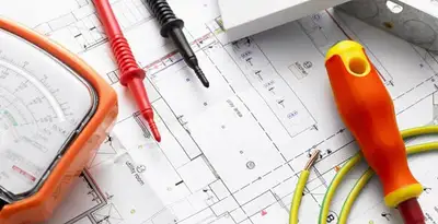 licensed electrician planning and testing electrical systems using professional tools in Peoria, IL