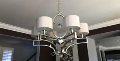 Modern chandelier installation with multiple light fixtures in Peoria, IL
