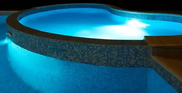 pool light installation and repair services highlighting illuminated pool interior lighting in Peoria, IL