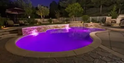 pool light installation and repair services illuminating a residential swimming pool in Peoria, IL