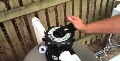 pool pumps service showing professional adjustment of pool pump control system in Peoria, IL