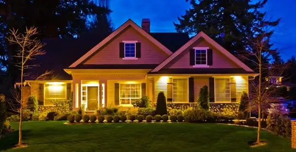 security light installation services illuminating a residential exterior at night in Peoria, IL